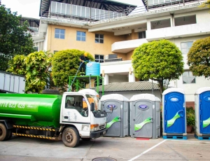 CleanTech Lanka service truck parked beside mobile toilet units